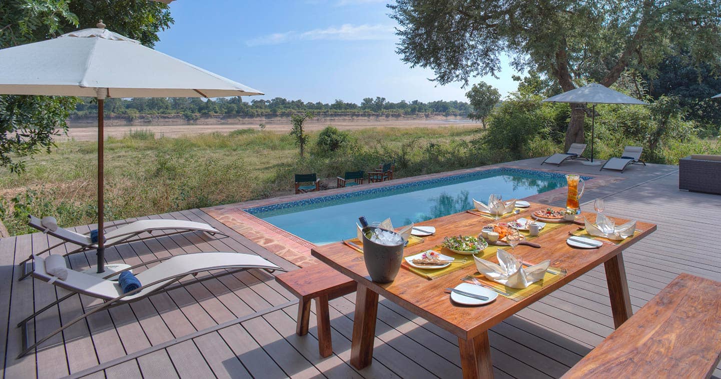 Enjoy Your Lunch Next to the Pool at Flatdogs Camp in the South Luangwa National Park in Zambia