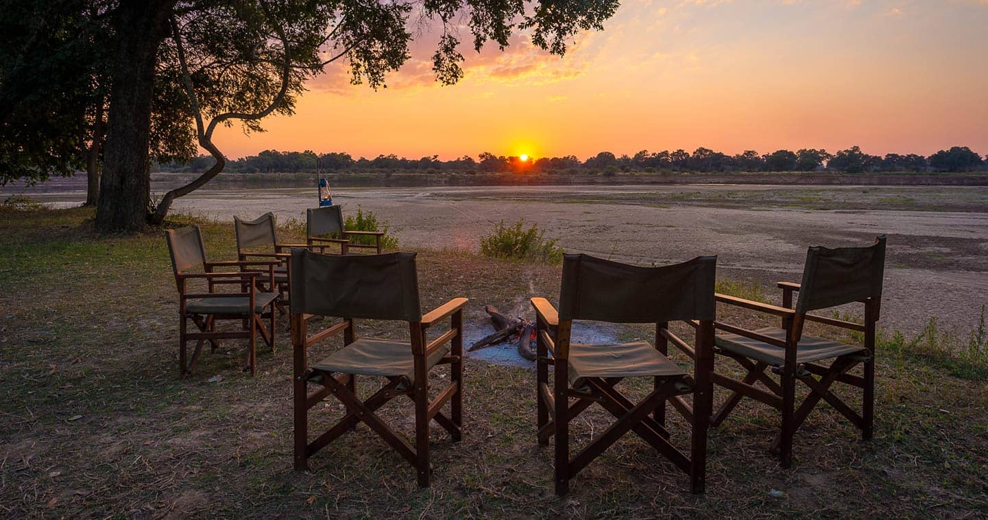 Enjoy the Sundown at the Boma When you Stay at Luangwa River Camp in the South Luangwa National Park