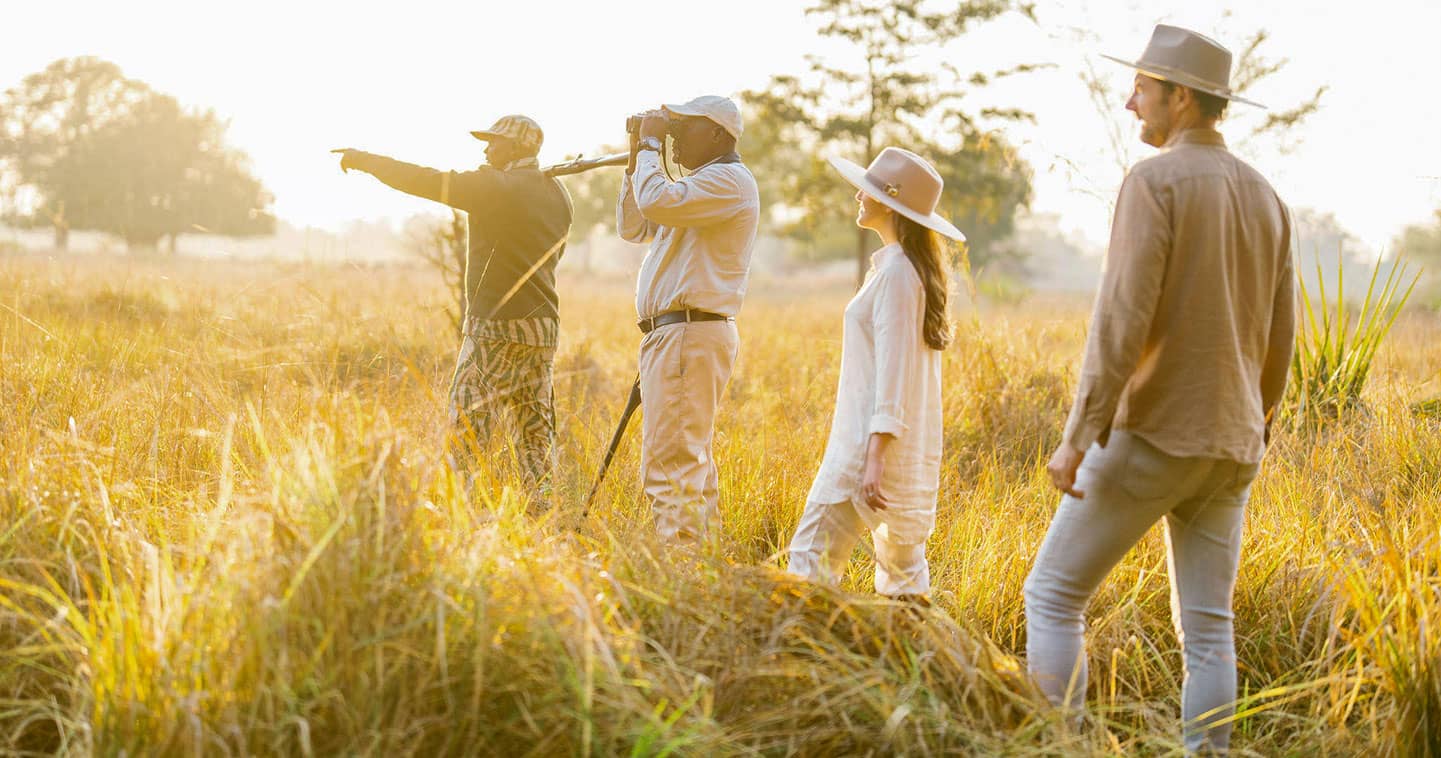 Enjoy a safari walk at Time + Tide Luwi Camp in Zambia